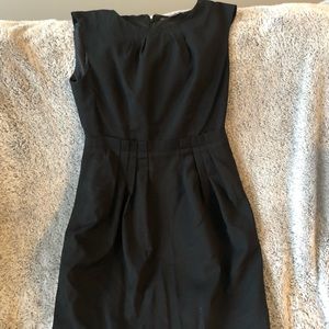 Black sleeveless dress with paper bag waist